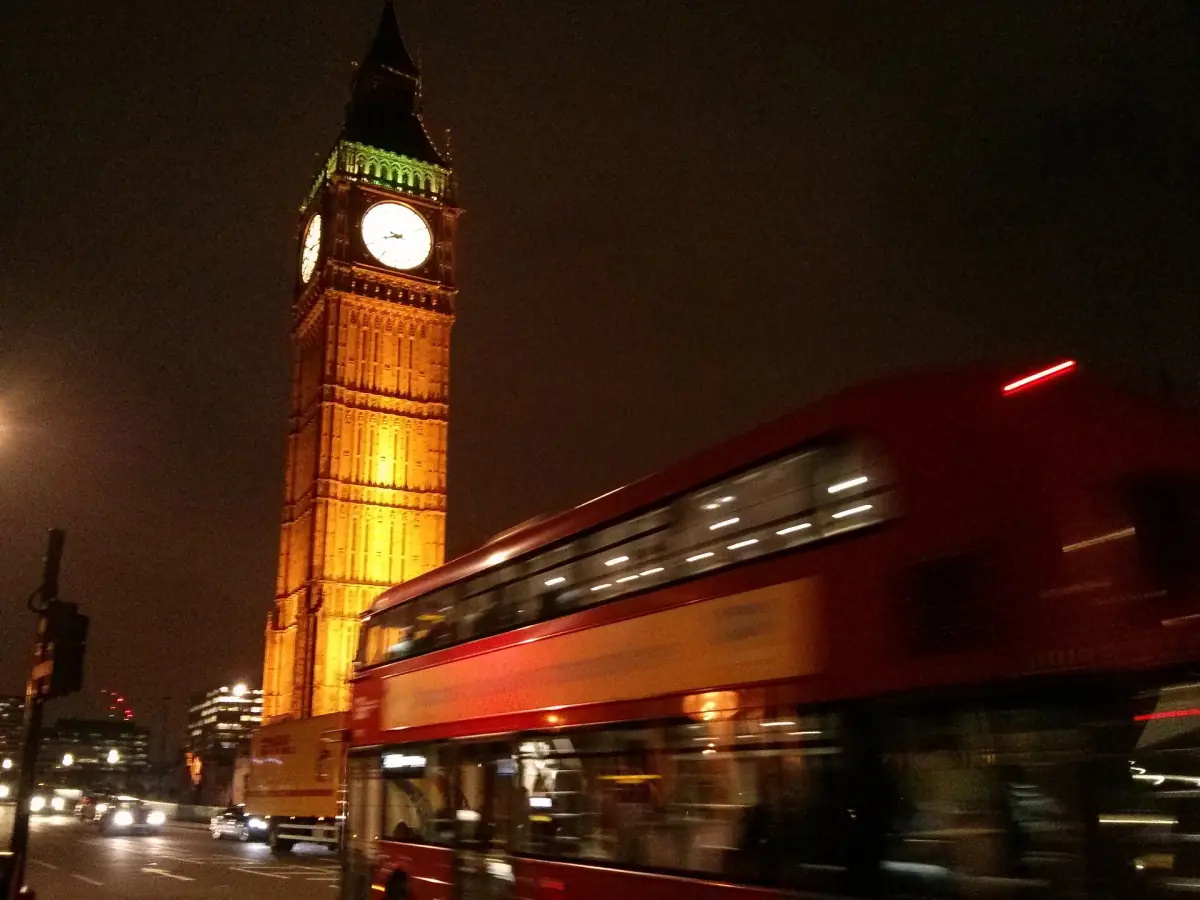 Elizabeth Tower at night with a passing bus